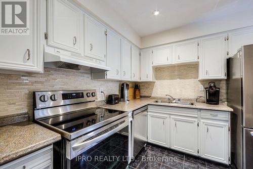 90 - 2120 Rathburn Road E, Mississauga, ON - Indoor Photo Showing Kitchen With Double Sink