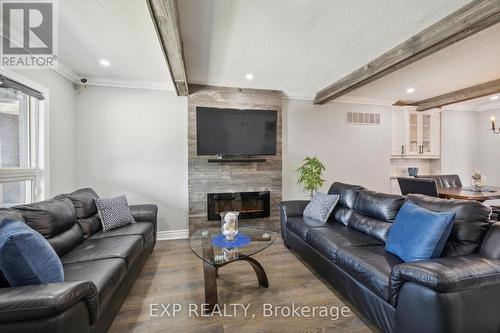 136 Cameron Avenue E, Hamilton, ON - Indoor Photo Showing Living Room With Fireplace