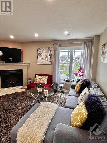 630 Lakeridge Drive, Ottawa, ON - Indoor Photo Showing Living Room With Fireplace