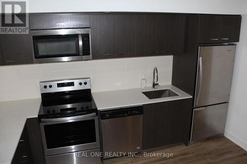318 - 2100 Bridletowne Circle, Toronto, ON - Indoor Photo Showing Kitchen With Stainless Steel Kitchen