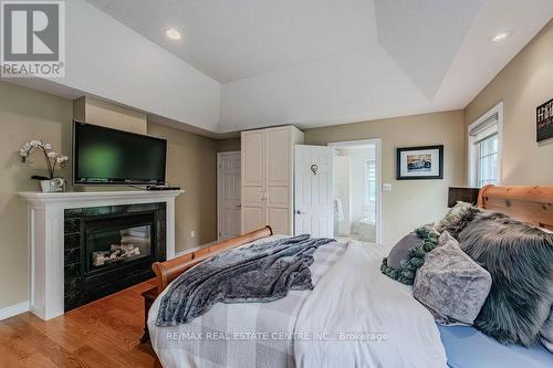 7568 Marden Road, Guelph/Eramosa, ON - Indoor Photo Showing Bedroom With Fireplace