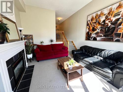 14 - 800 Dundas Street W, Mississauga, ON - Indoor Photo Showing Living Room With Fireplace