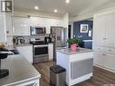 1309 Heidgerken Crescent, Humboldt, SK  - Indoor Photo Showing Kitchen With Stainless Steel Kitchen With Double Sink 