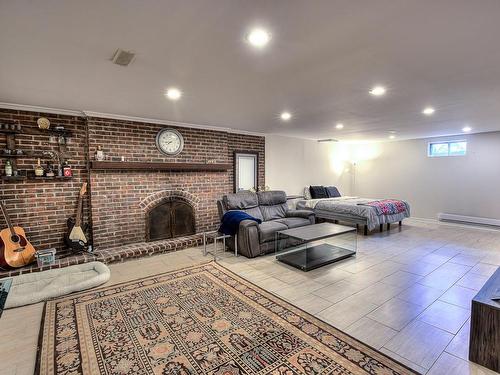 Salle de jeux - 19 Rue St-Judes, Laval (Chomedey), QC - Indoor With Fireplace