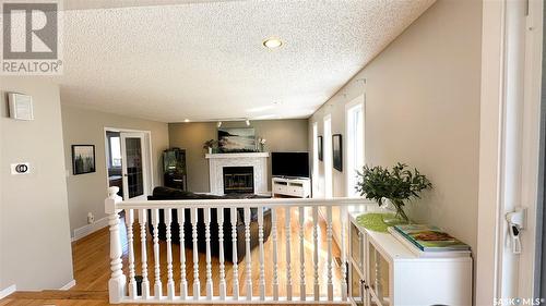 3119 Spicer Place E, Regina, SK - Indoor Photo Showing Other Room With Fireplace