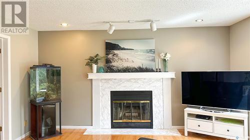 3119 Spicer Place E, Regina, SK - Indoor With Fireplace