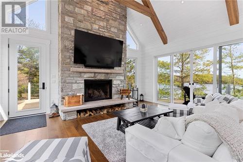 1086 Pennwood Road, Muskoka Lakes, ON - Indoor Photo Showing Living Room With Fireplace