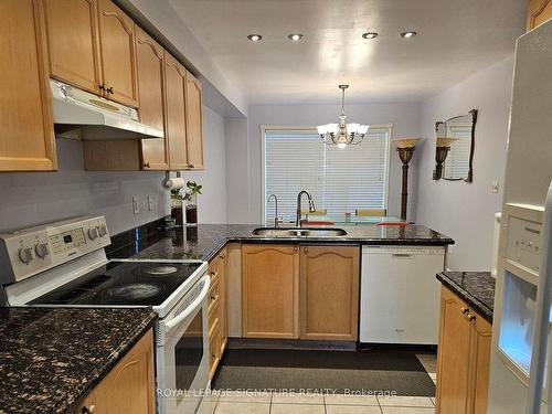 144-5980 Whitehorn Ave, Mississauga, ON - Indoor Photo Showing Kitchen With Double Sink