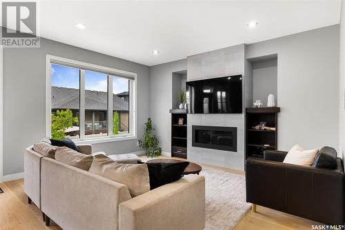 3933 Sandhill Crescent, Regina, SK - Indoor Photo Showing Living Room With Fireplace