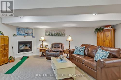 75 Chadwin Drive, Kawartha Lakes, ON - Indoor Photo Showing Living Room With Fireplace