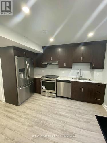 22 Nightland Court, Brampton, ON - Indoor Photo Showing Kitchen With Double Sink