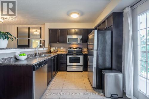 201 - 1340 Main Street E, Milton, ON - Indoor Photo Showing Kitchen With Double Sink