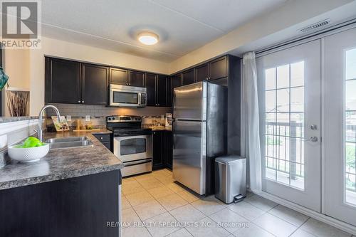 201 - 1340 Main Street E, Milton, ON - Indoor Photo Showing Kitchen With Double Sink