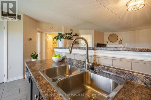 201 - 1340 Main Street E, Milton, ON - Indoor Photo Showing Kitchen With Double Sink