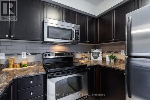 201 - 1340 Main Street E, Milton, ON - Indoor Photo Showing Kitchen With Upgraded Kitchen