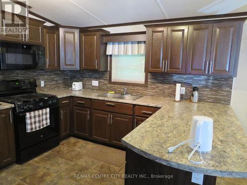 163 - 22790 Amiens Road, Middlesex Centre (Komoka), ON - Indoor Photo Showing Kitchen With Double Sink