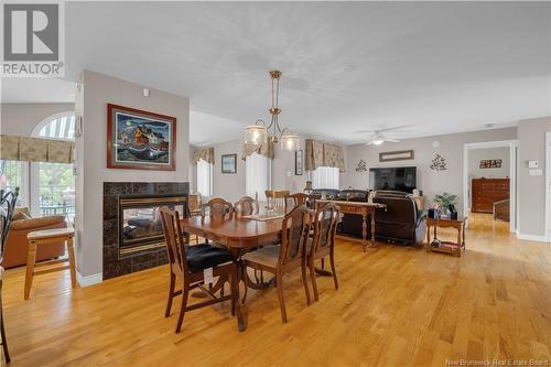 15 Belleview Court, Kingston, NB - Indoor Photo Showing Dining Room With Fireplace