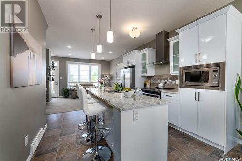 130 3229 Elgaard Drive, Regina, SK - Indoor Photo Showing Kitchen With Upgraded Kitchen