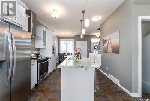 130 3229 Elgaard Drive, Regina, SK - Indoor Photo Showing Kitchen With Stainless Steel Kitchen With Upgraded Kitchen