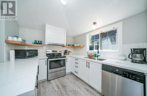 14 Warwick Avenue, Lambton Shores (Grand Bend), ON - Indoor Photo Showing Kitchen With Double Sink