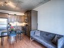 Living room - 901-1235 Rue Bishop, Montréal (Ville-Marie), QC  - Indoor Photo Showing Kitchen With Stainless Steel Kitchen 