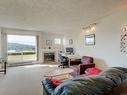 205-6585 Country Rd, Sooke, BC  - Indoor Photo Showing Living Room With Fireplace 