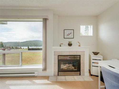 205-6585 Country Rd, Sooke, BC - Indoor Photo Showing Living Room With Fireplace