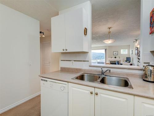 205-6585 Country Rd, Sooke, BC - Indoor Photo Showing Kitchen With Double Sink