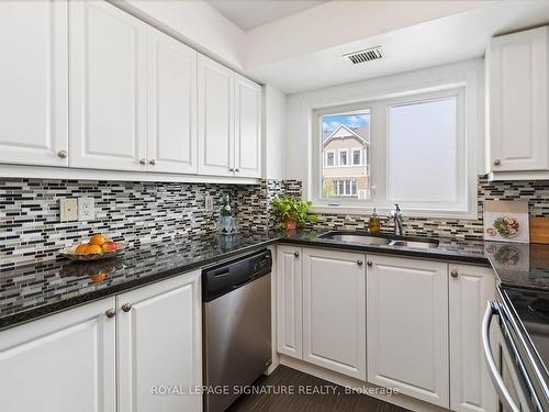 203-1005 Nadalin Hts, Milton, ON - Indoor Photo Showing Kitchen With Double Sink