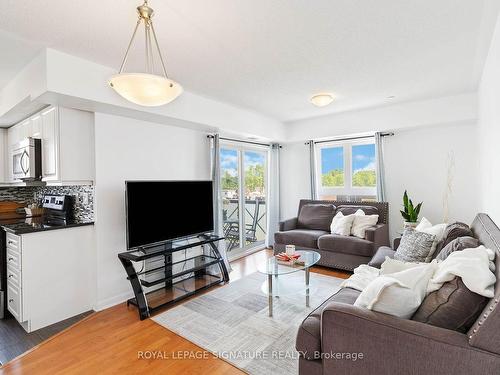 203-1005 Nadalin Hts, Milton, ON - Indoor Photo Showing Living Room