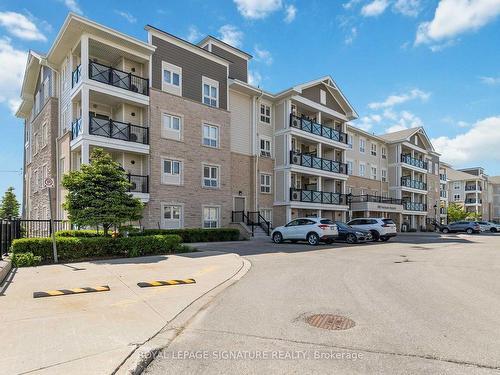 203-1005 Nadalin Hts, Milton, ON - Outdoor With Balcony With Facade