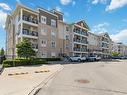 203-1005 Nadalin Hts, Milton, ON  - Outdoor With Balcony With Facade 