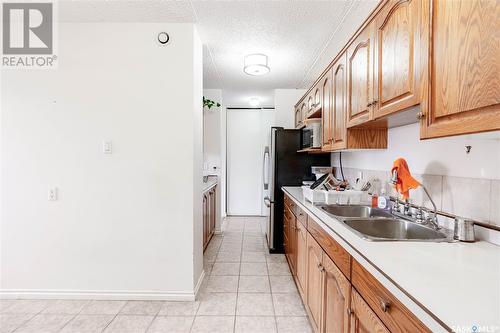 317 4045 Rae Street, Regina, SK - Indoor Photo Showing Kitchen With Double Sink