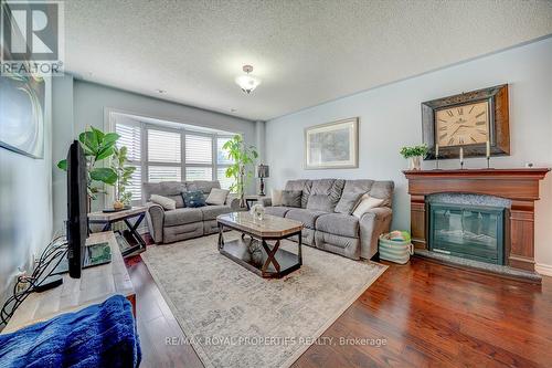 99 Mondeo Drive, Toronto, ON - Indoor Photo Showing Living Room With Fireplace
