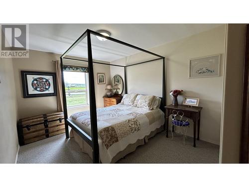 5153 Lakes Road, 108 Mile Ranch, BC - Indoor Photo Showing Bedroom