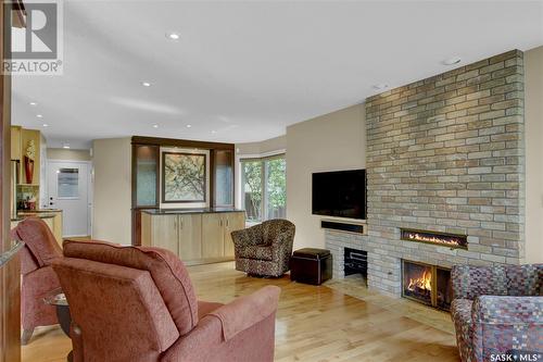 2415 Klein Place E, Regina, SK - Indoor Photo Showing Living Room With Fireplace