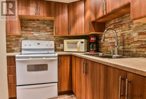 521 Waterloo Rd, Timmins, ON - Indoor Photo Showing Kitchen With Double Sink