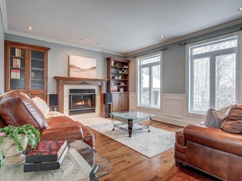 Living room - 53 Av. Du Bel-Horizon, Sainte-Julie, QC - Indoor Photo Showing Living Room With Fireplace