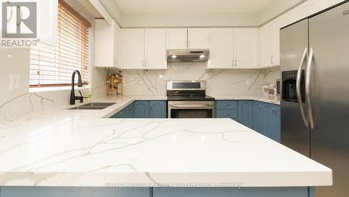 93 Starhill Crescent, Brampton, ON - Indoor Photo Showing Kitchen With Double Sink