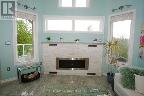 23 Sovereign'S Gate, Barrie (Innis-Shore), ON - Indoor Photo Showing Other Room With Fireplace