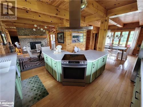Very spacious Island in Kitchen - 669 Skyhills Road, Huntsville, ON - Indoor With Fireplace