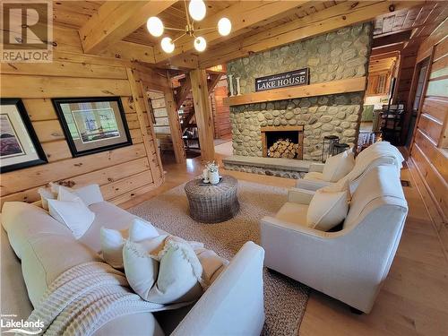 Comfortable Living room - 669 Skyhills Road, Huntsville, ON - Indoor Photo Showing Living Room With Fireplace