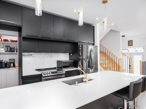 Cuisine - 5300 Boul. Westley, Longueuil (Saint-Hubert), QC - Indoor Photo Showing Kitchen With Double Sink