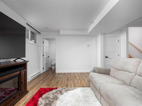 Salle familiale - 5300 Boul. Westley, Longueuil (Saint-Hubert), QC - Indoor Photo Showing Living Room With Fireplace