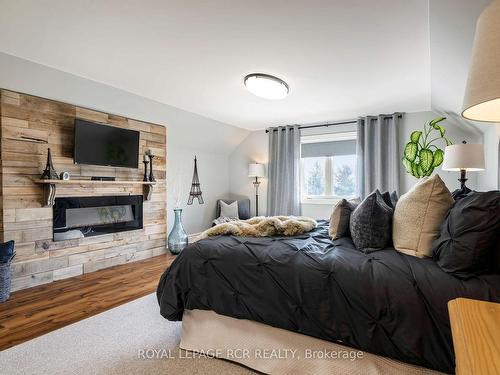 513442 2Nd Line, Amaranth, ON - Indoor Photo Showing Bedroom With Fireplace