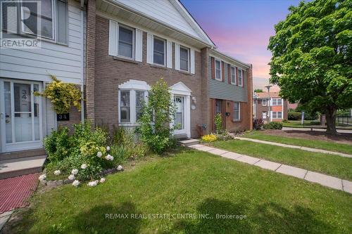 33 - 1020 Central Park Drive, Brampton, ON - Outdoor With Facade