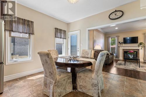 584 Kokanee Road, London, ON - Indoor Photo Showing Dining Room With Fireplace