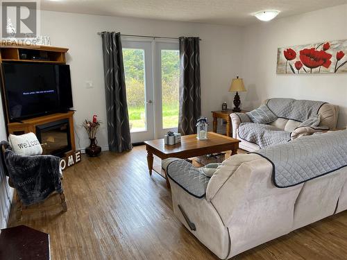 23 Main Street, Black Duck Brook, NL - Indoor Photo Showing Living Room With Fireplace