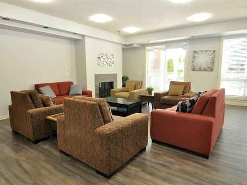 103-3550 Woodsdale Road, Lake Country, BC - Indoor Photo Showing Living Room With Fireplace