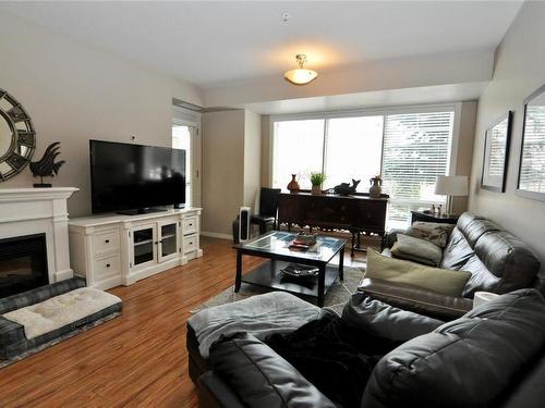 103-3550 Woodsdale Road, Lake Country, BC - Indoor Photo Showing Living Room With Fireplace